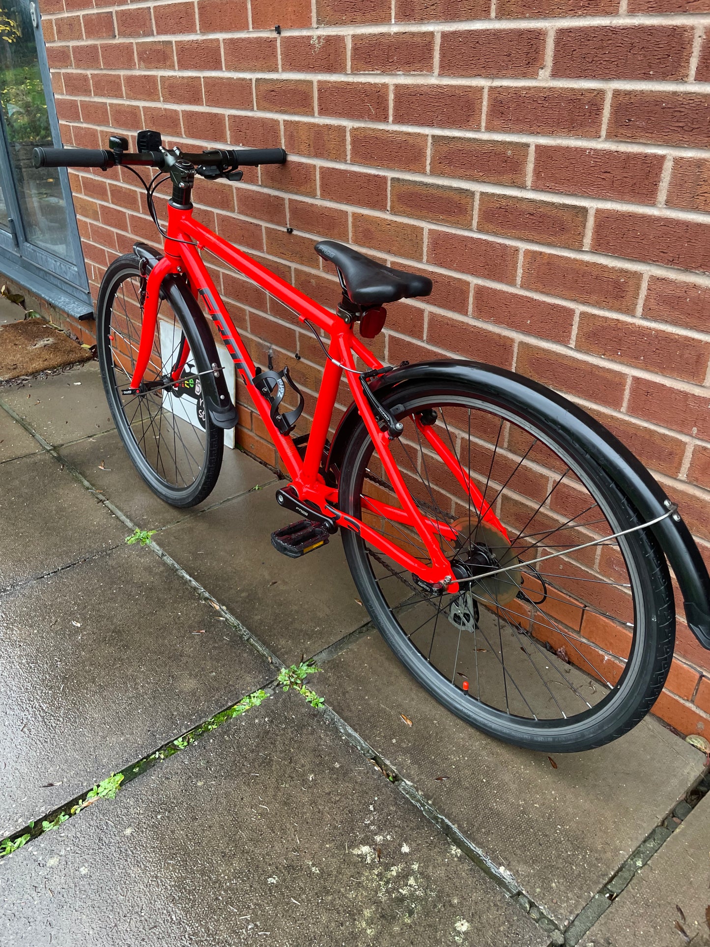 A Pre Loved Frog Bike For Sale Neon Red Frog 73, 26” wheels, 8 speed, V brakes, mudguards, bottle cage, very lightweight, nationwide delivery is available.