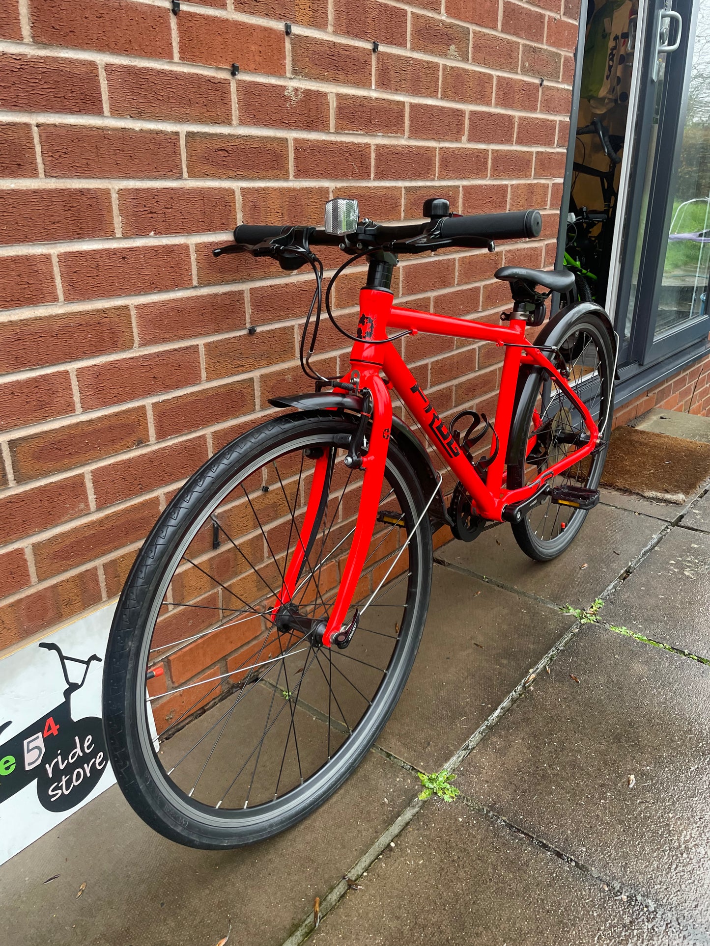 A Pre Loved Frog Bike For Sale Neon Red Frog 73, 26” wheels, 8 speed, V brakes, mudguards, bottle cage, very lightweight, nationwide delivery is available.