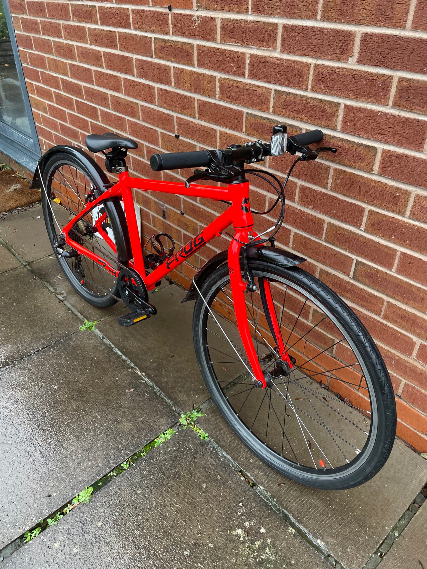 A Pre Loved Frog Bike For Sale Neon Red Frog 73, 26” wheels, 8 speed, V brakes, mudguards, bottle cage, very lightweight, nationwide delivery is available.