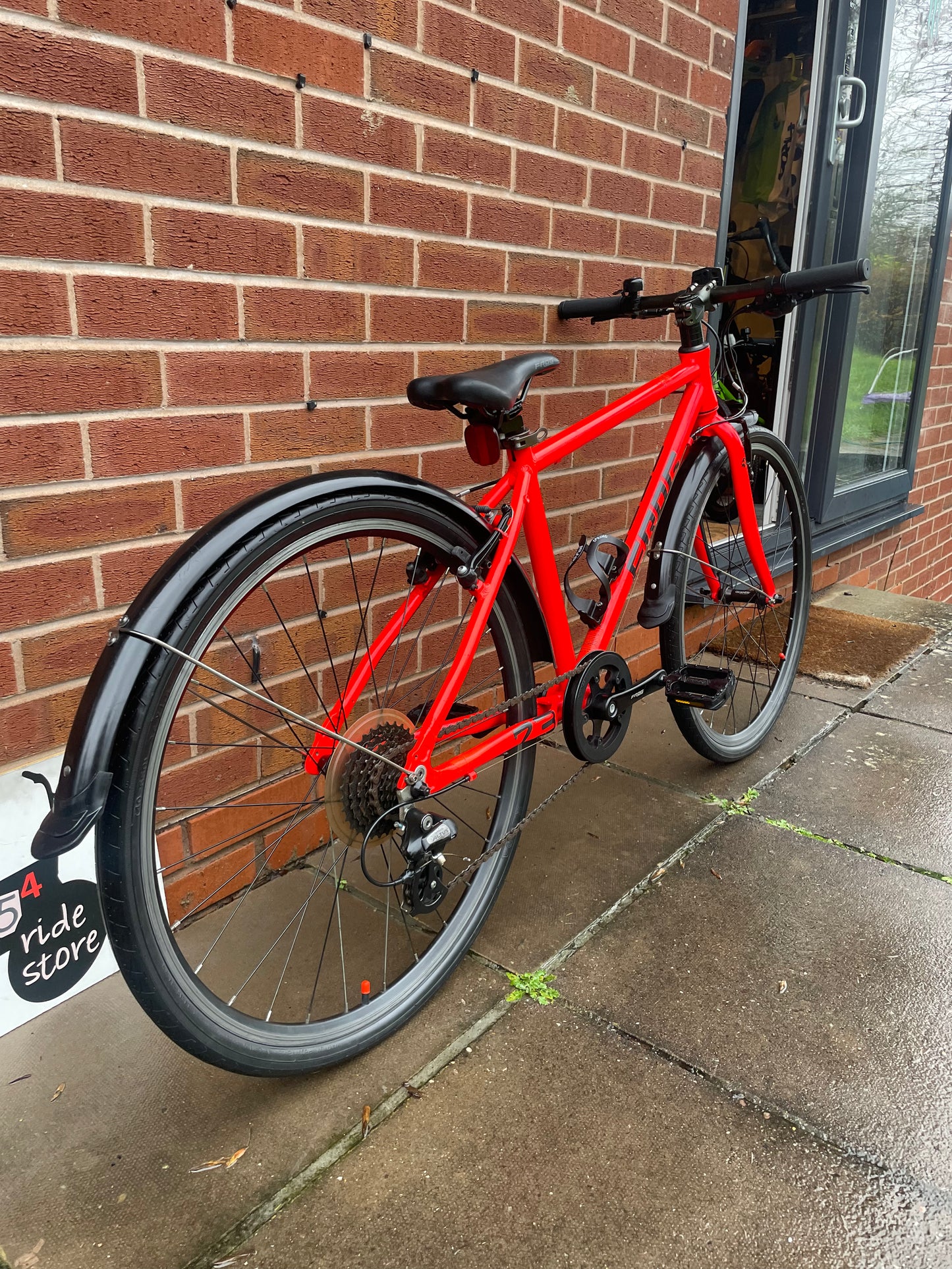 A Pre Loved Frog Bike For Sale Neon Red Frog 73, 26” wheels, 8 speed, V brakes, mudguards, bottle cage, very lightweight, nationwide delivery is available.